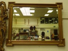 Rectangular bevelled edge wall mirror in gilt frame