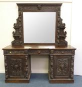 Victorian opulently carved oak twin pedestal sideboard and raised back with inset bevelled mirror