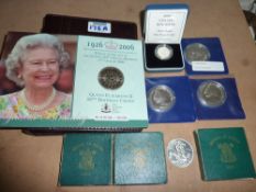 Four silver proof crowns and a silver proof £1 coin; four 1951 Festival of Britain crowns