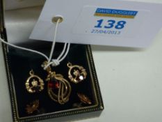 9ct gold pendant set with a garnet hallmarked, pair of similar ear-rings and a pair of stud ear-