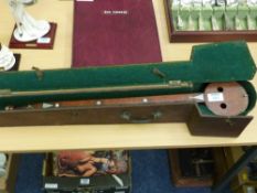 19th Century single string mahogany and coconut shell musical instrument in fitted case