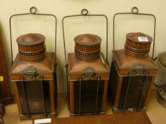 Set of three copper lanterns and a brass hanging lantern
