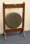 Edwardian brass gong on oak stand 70cm x 115cm