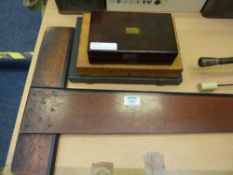 Rosewood cased set of drawing instruments, another set, a T square and a an artist's box