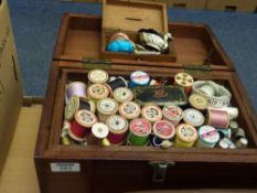 Mahogany sewing box and contents including pin cushion in the form of a duck, Acme whistles etc