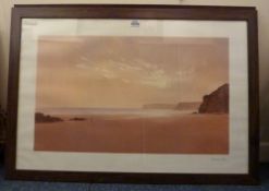 A modern coastal scene and a woodland scene prints in matching frames.
