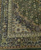 Modern Persian design green ground wool rug