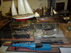 Model of a Japanese warship, other battleships, sailing ships and trains