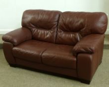 Modern two seat settee in maroon leather