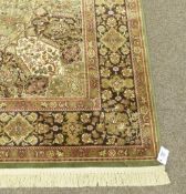 Green ground Madras rug, 230cm x 150cm