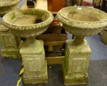 Four composite stone garden urns
