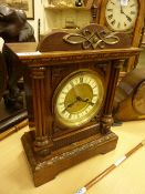 German oak striking mantle clock with key and pendulum