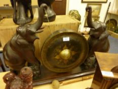 Late Victorian large table top gong stand in the form of two carved oak elephants length 86cm