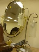 Two branch table lamp and brass framed oval free standing dressing table mirror