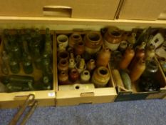 Collection of old glass bottles and stone jars in three boxes