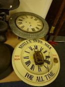 Two original advertising wall clocks in 'Milkmaid Milk Now's The Time TO Buy It' and 'Nestle's Swiss
