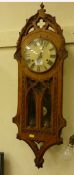 Victorian wall clock in golden oak Gothic case