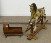 Early 20th Century small rocking horse by A W Gamage Ltd London and a stained pine rocking crib