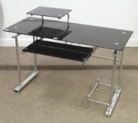 Black glass and chrome computer desk with raised monitor platform, pull out keyboard tray and cpu