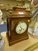 Late Victorian mahogany cased bracket clock with brass inlay finials and carrying handle, convex