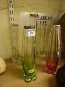 Four early 20th Century glass specimen vases with hallmarked silver rims 25.5cm diminishing