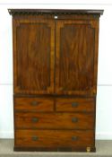 Early 19th Century mahogany linen press, two cupboards enclosing  four sliding trays, above two