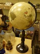 Early 20th Century globe with turned wooden base