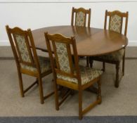 Old Charm medium oak circular extending dining table and four chairs