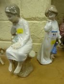 Lladro figure of a boy reading and Nao figure of a girl with a teddy bear