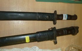 Two WWI bayonets with leather scabbards