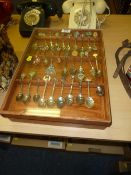 Souvenir teaspoons in two wooden cases