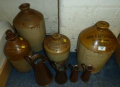 Four Victorian/Edwardian stoneware bottles with Yorkshire retailer's names and four copper conical