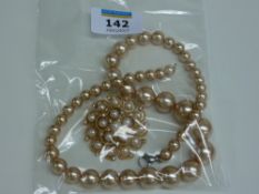 Pearl diamante brooch and a gold shell pearl necklace