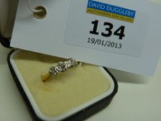 Three stone diamond ring stamped 18ct