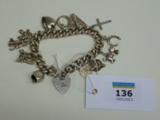 Hallmarked silver chain link bracelet with charms