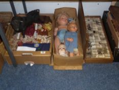 Two early 20th Century dolls, box of upholstery trimmings etc and a basket of eastern items
