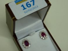 Fine ruby (approx 1.85) and diamond ear-rings hallmarked 18ct