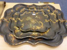 Set of three early Victorian graduating papier mache trays with serpentine borders painted with