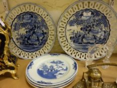 Pair of blue and white Arita chargers dia.33cm, pierced borders and three Chinese export plates 18th