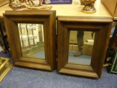 Two rectangular bevelled edge mirrors in hard wood moulded frames