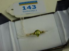 9ct gold ring set with three peridots hallmarked