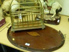 Edwardian brass and oak magazine stand and an Edwardian mahogany tray inlaid with satinwood shell