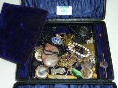 Black leather jewellery box containing Victorian jet and vintage brooches, badges etc