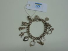 Hallmarked silver chain link bracelet with charms