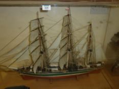 Model of a three-masted sailing boat and a model beer dray pulled by eight horses