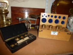 Nickel plated balance by Johnsons of Hendon and two boxed sets of brass weights