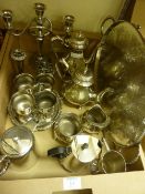 Four piece tea set, matching oval tray, candelabra and other silver-plated ware in one box