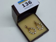 Pair of pearl drop hoop ear-rings stamped 375