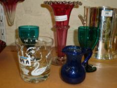 Cranberry glass vase, quilted blue glass jug, white enamelled tumbler, two green 19th century