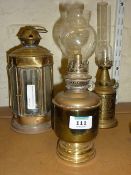Two brass oil lamps and a brass lantern